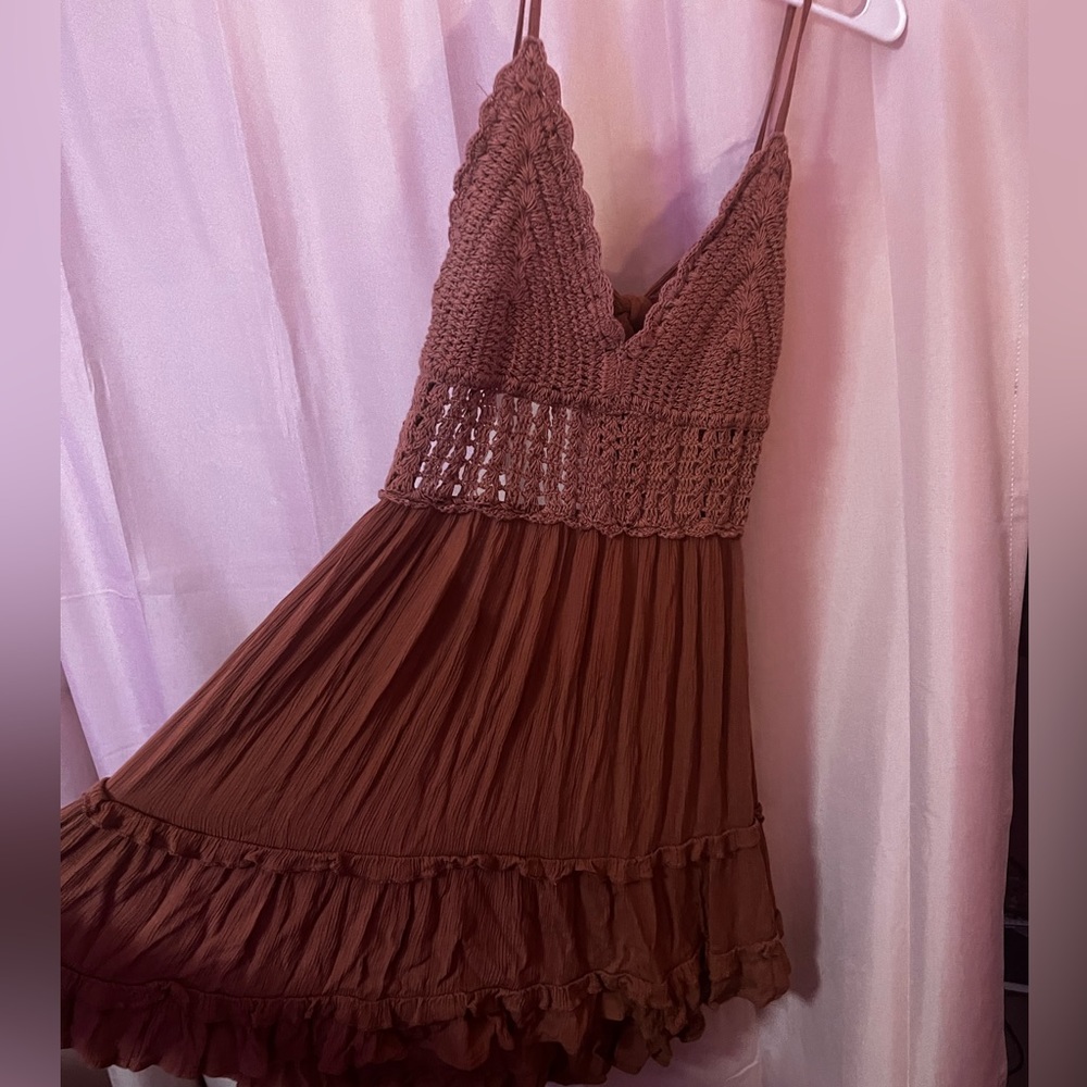 Brown, open back dress. Top of dress is knitted.